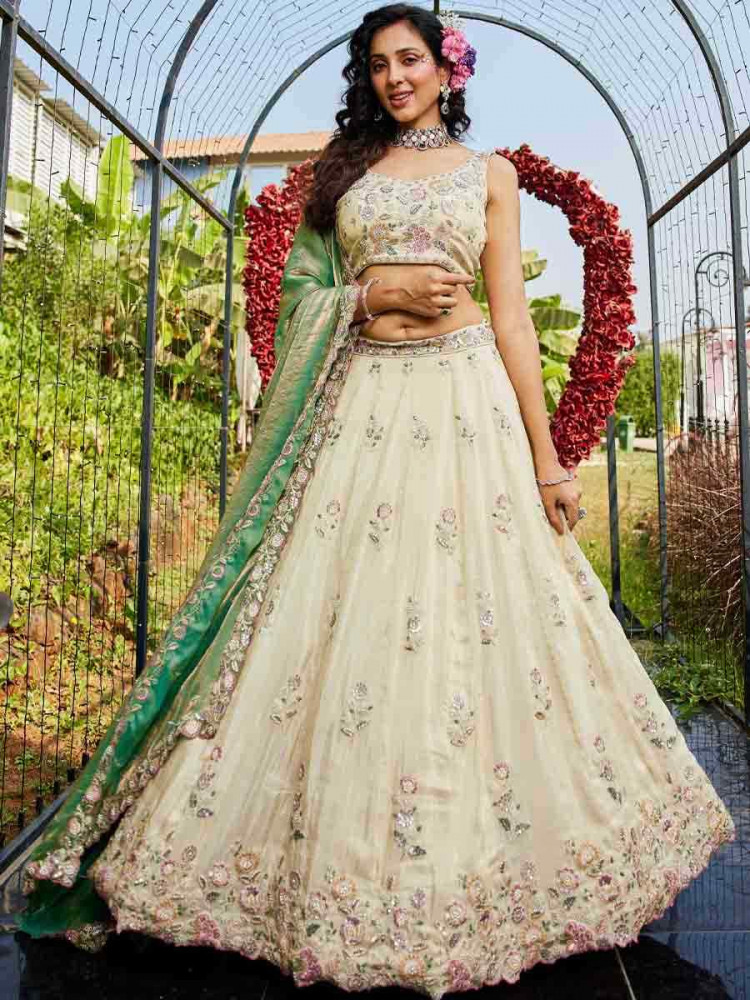 Cream Tissue Embroidery Reception Party Wear Heavy Border Lehenga Choli