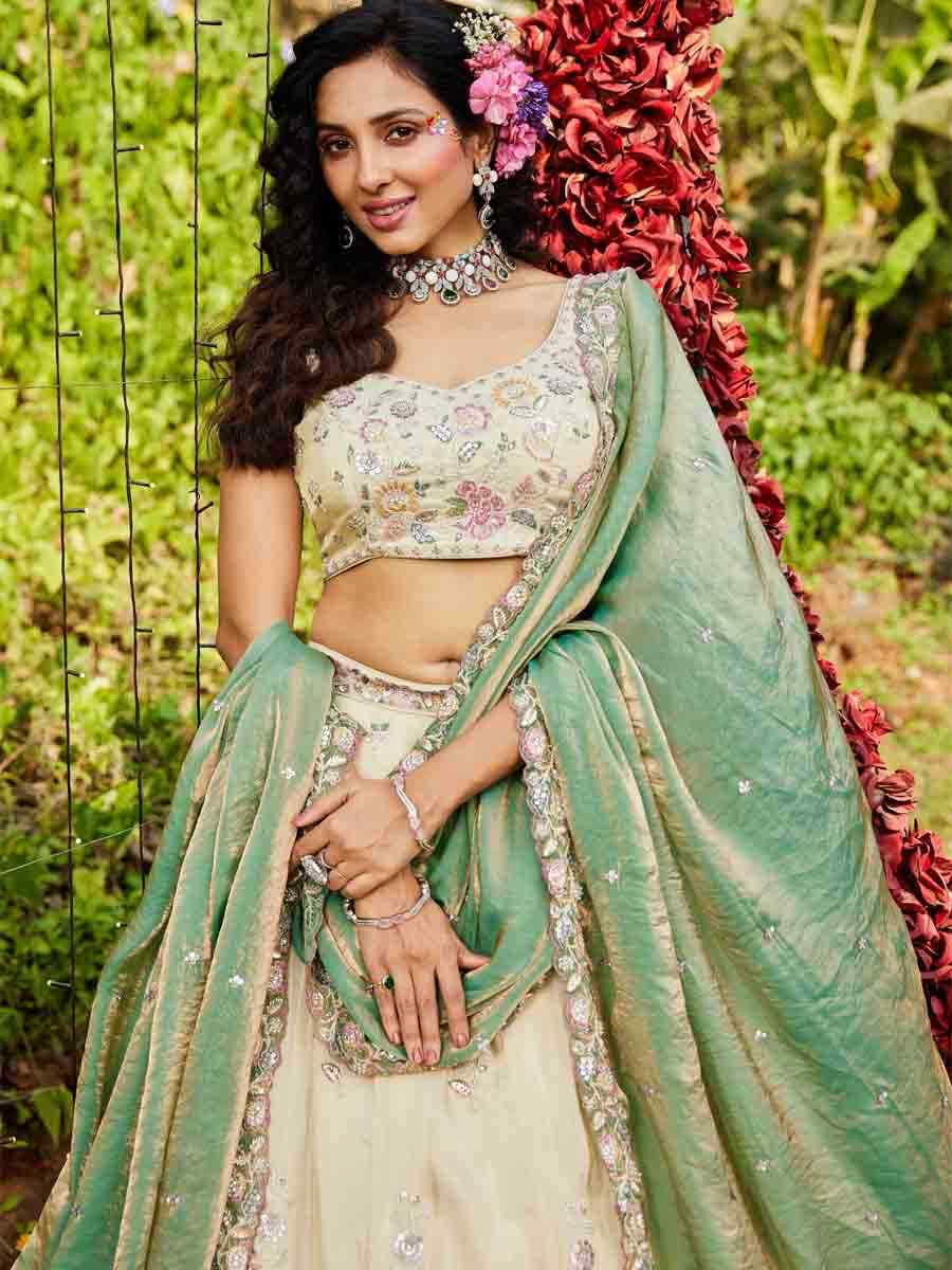 Cream Tissue Embroidery Reception Party Wear Heavy Border Lehenga Choli