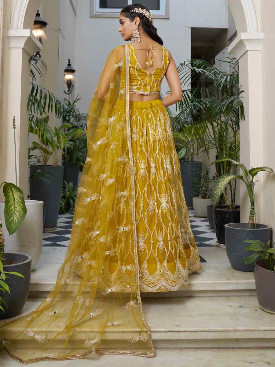 Mustard Butterfly Net Embroidery Reception Party Wear Heavy Border Lehenga Choli