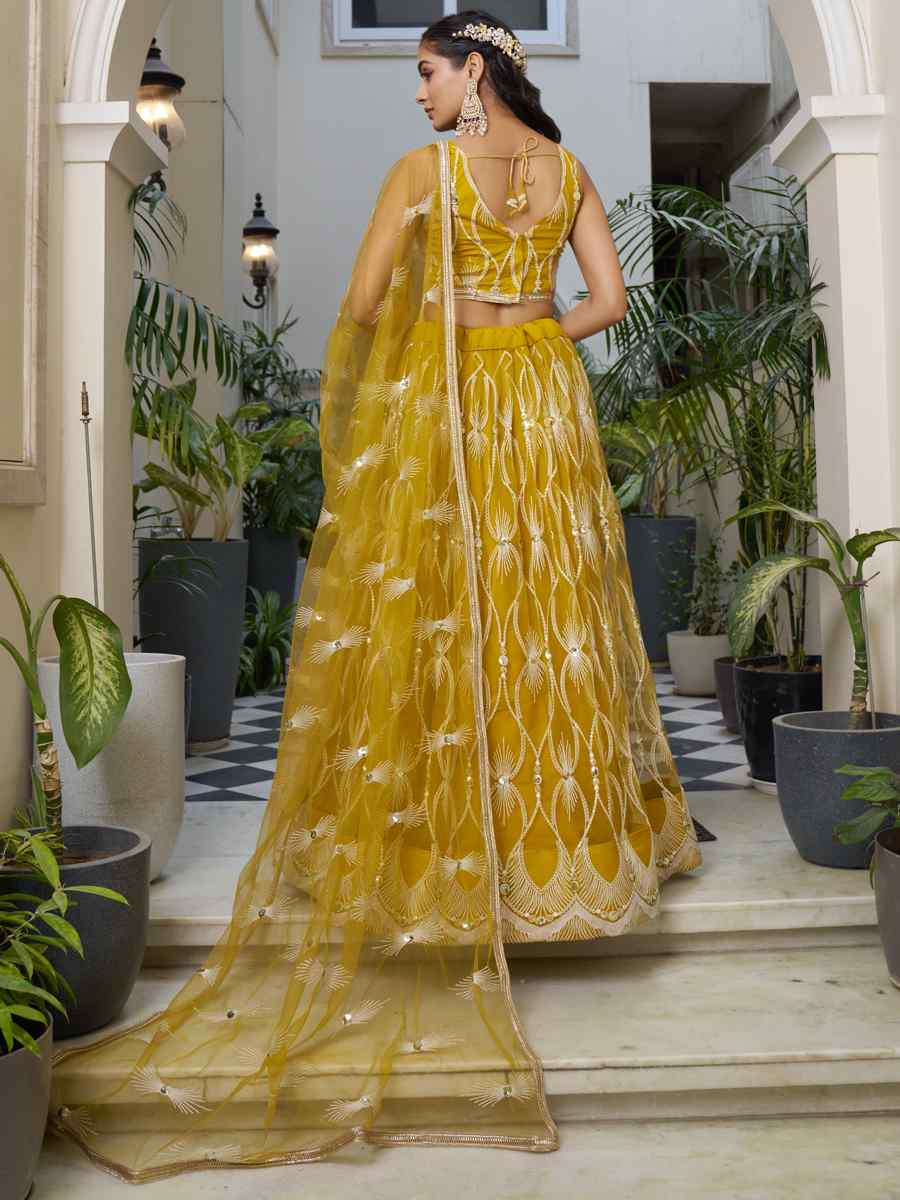 Mustard Butterfly Net Embroidery Reception Party Wear Heavy Border Lehenga Choli