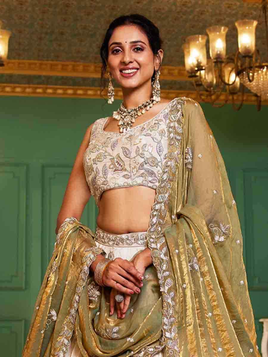 Off White Tissue Embroidery Reception Party Wear Heavy Border Lehenga Choli