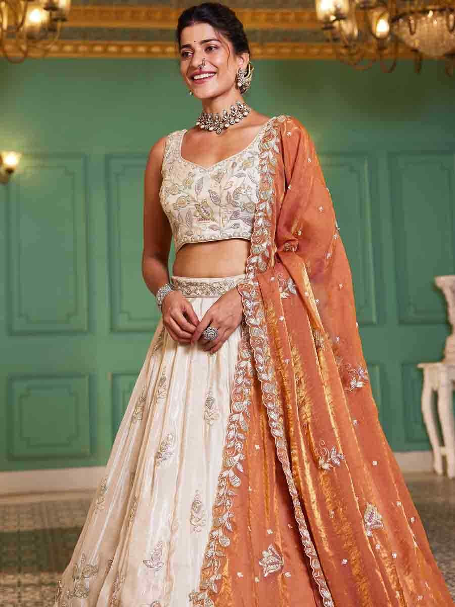 Off White Tissue Embroidery Reception Party Wear Heavy Border Lehenga Choli