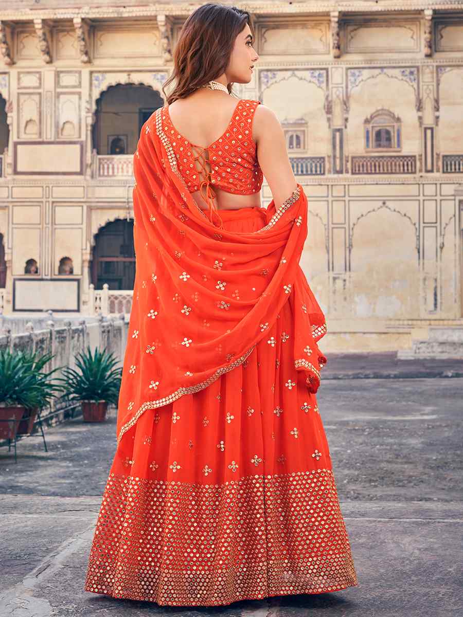 Orange Georgette Embroidered Reception Wedding Heavy Border Lehenga Choli