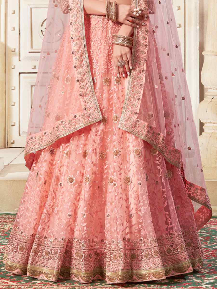 Peach Premium Net Embroidered Reception Party Wear Heavy Border Lehenga Choli