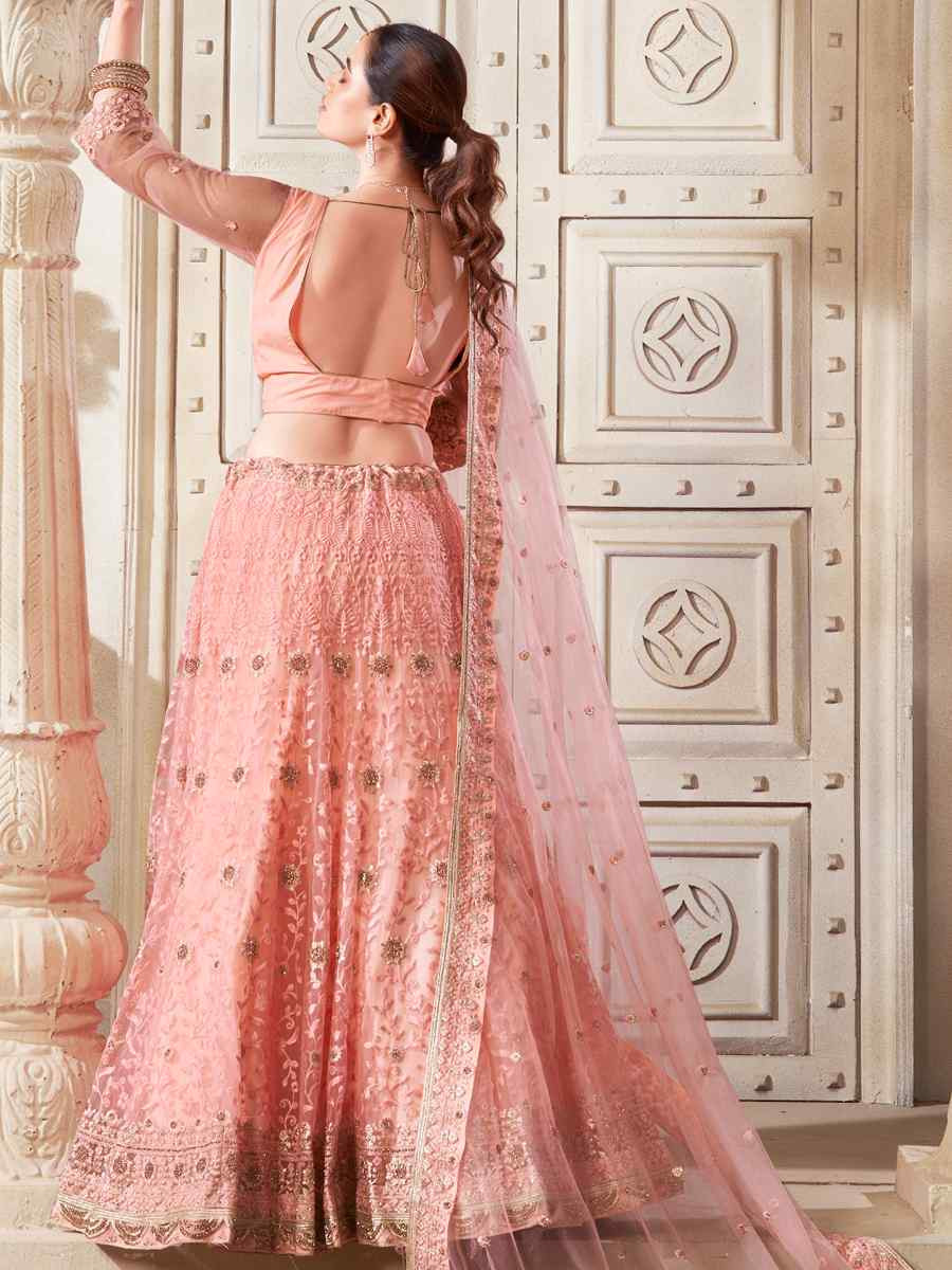 Peach Premium Net Embroidered Reception Party Wear Heavy Border Lehenga Choli