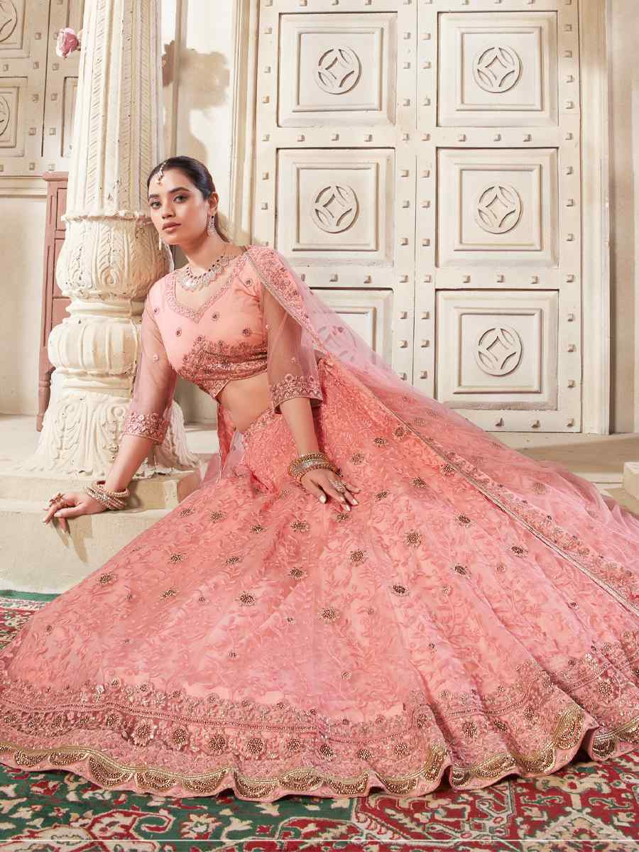 Peach Premium Net Embroidered Reception Party Wear Heavy Border Lehenga Choli