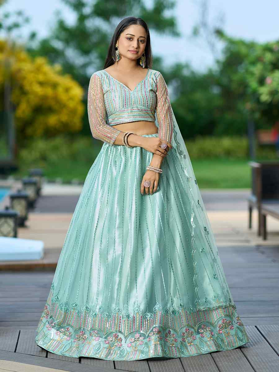 Pista Net Embroidered Wedding Party Wear Heavy Border Lehenga Choli