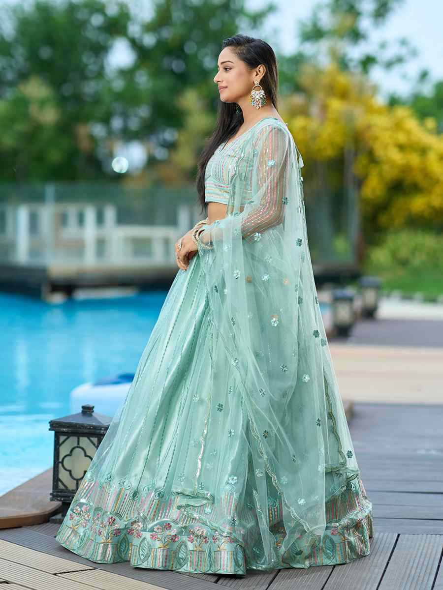 Pista Net Embroidered Wedding Party Wear Heavy Border Lehenga Choli